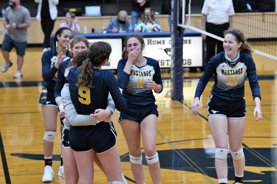 The+Lady+Mustangs+celebrate+right+after+their+win.