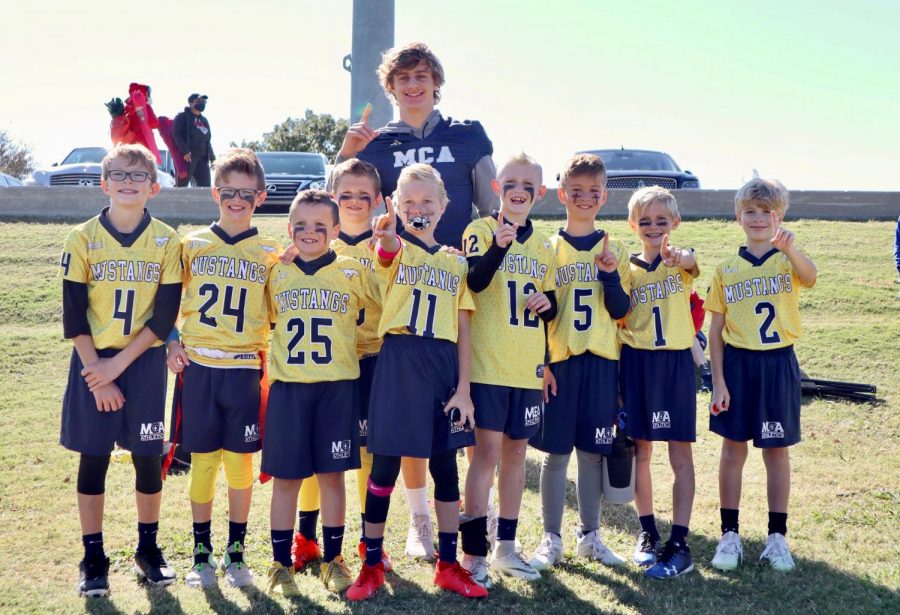 Fourth grade blue team poses for a picture after winning the championship game. 