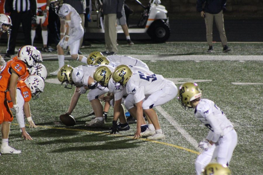 The offensive line men setting up for the snap.