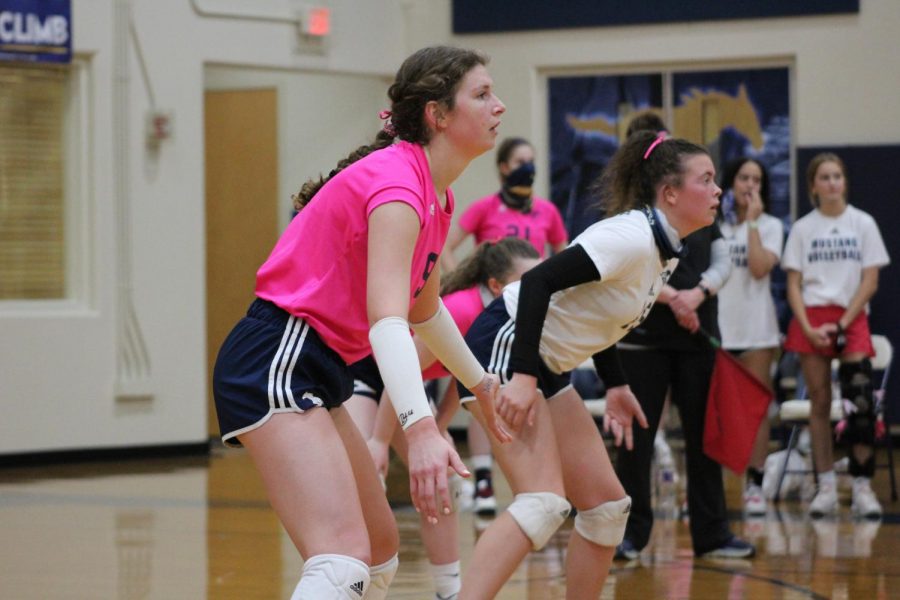 Senior Captains Ava Grace Haggard and Micah McDowell ready for the ball to be served.