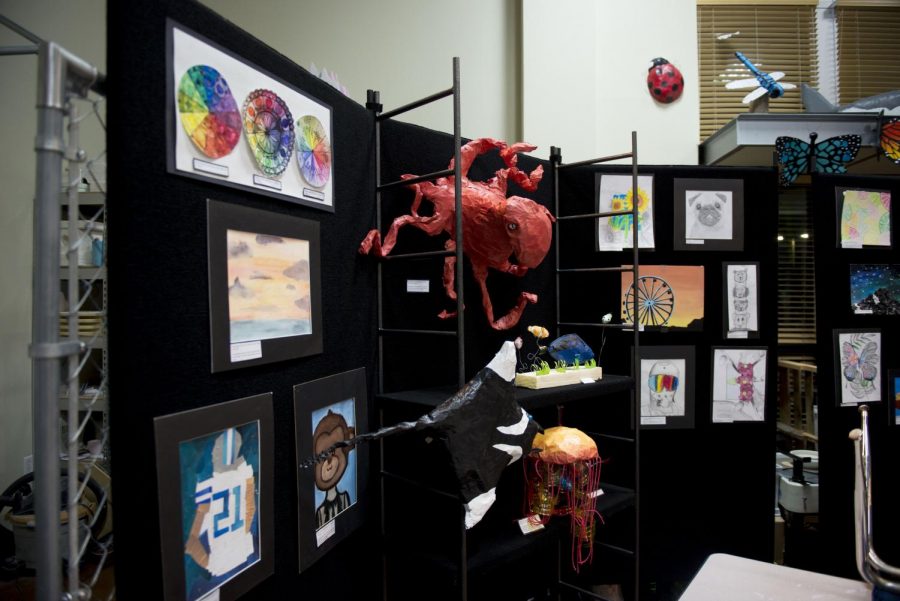 MCAs art class showcases art works like a paper mache and paintings.