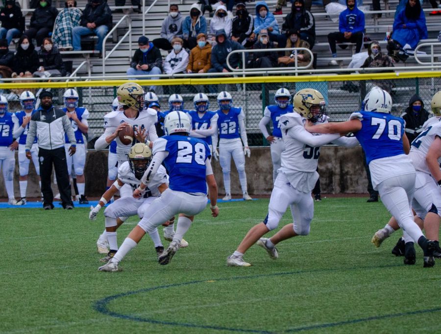 Mustangs attempt to run the ball up the field on offense. 