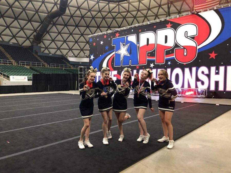 The Varsity Cheerleaders with their medals after placing second.  