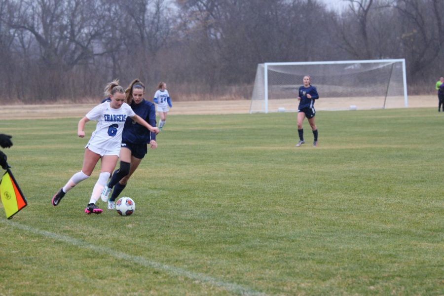 Senior Ruth Perry defends a Dallas Christian player in a rainy game. 