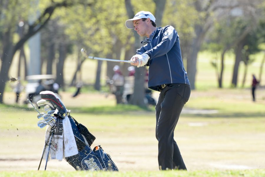 Senior+Peter+Michael+Clark+finishing+his+round+with+a+wedge+shot.