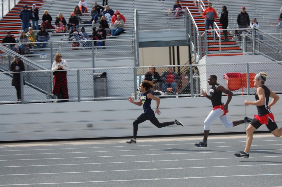 Senior Maliq Brock breaks 200 meter dash school record. 