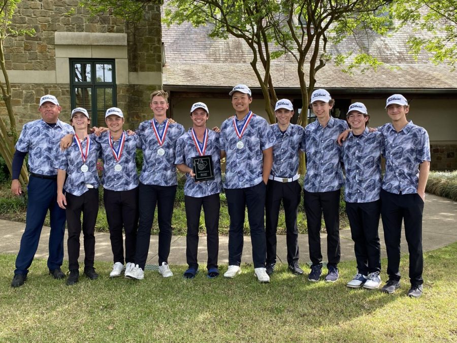 Boys Golf poses for a picture with their medals after winning the District Championship.