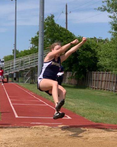 7th Grader Natalie Siebrasse participates in the long jump.