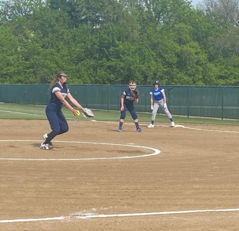 Eighth grader Ella Van Voorst in motion as she pitches the ball.
