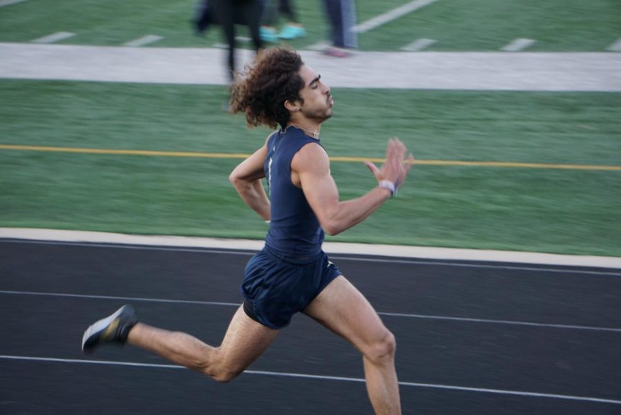 Senior Maliq Brock breaks the school record in the 400 meter race. 