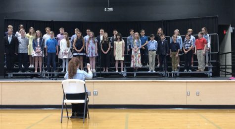 Fifth graders singing their song during graduation.