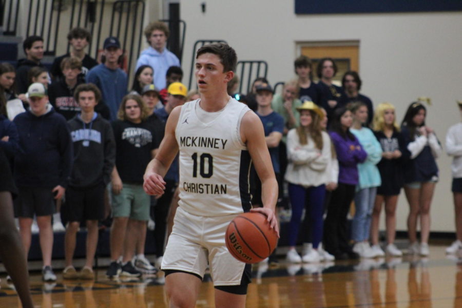 Junior Bobby McWard dribbles down the court against Bishop Lynch. 