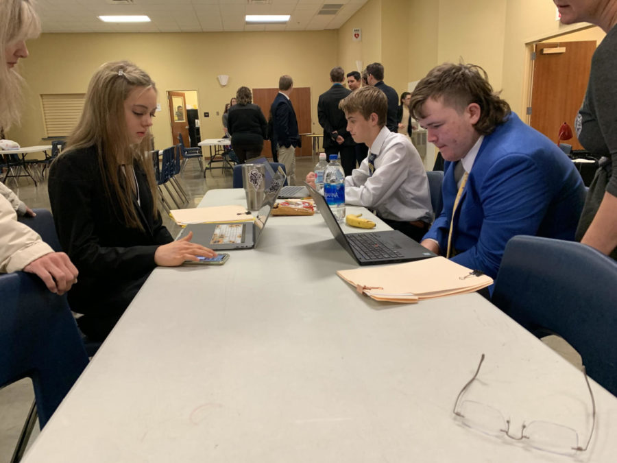 Students strategize before their next debate.