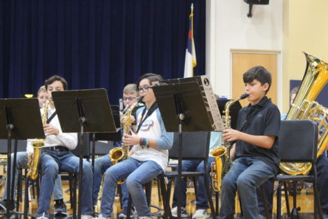 Middle school band members performing at the fall band concert. 