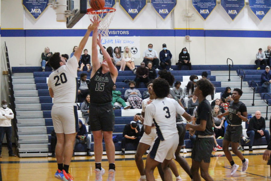 Senior Jack Liebling goes up for the bucket.