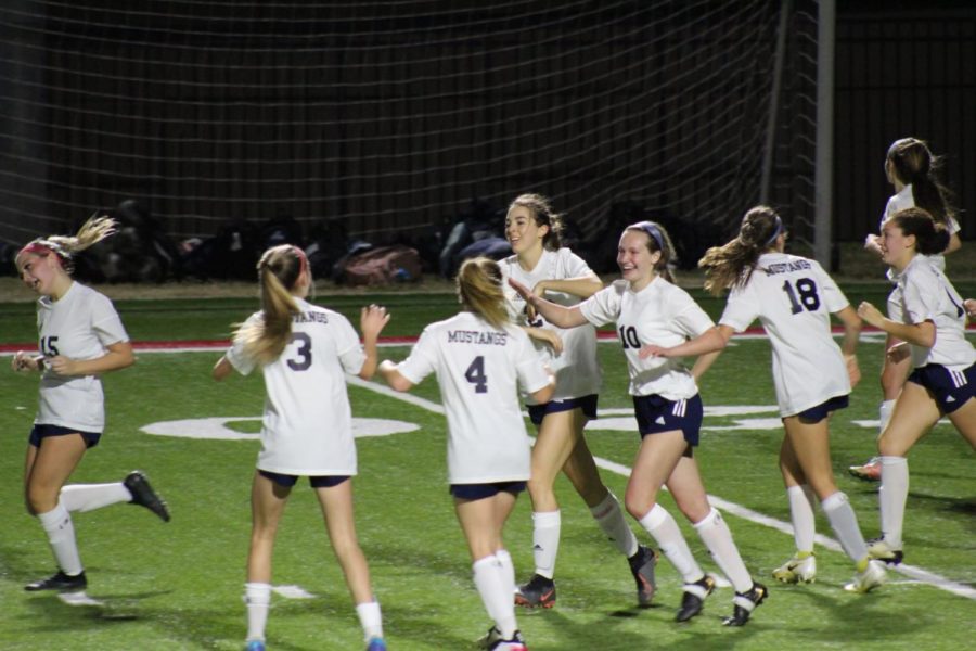 The+Mustangs+celebrating+after+the+game+tying+goal.+