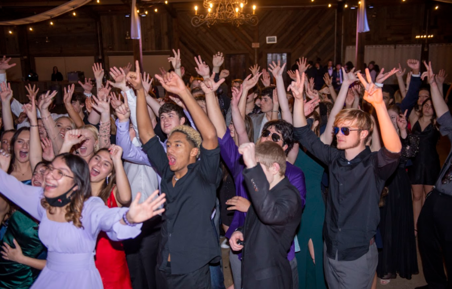 Students put their hands in the air for DJ K Sprinkles.