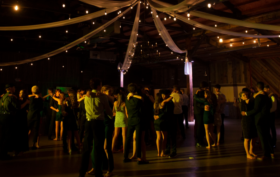 Students dance to a slow song with their dates.