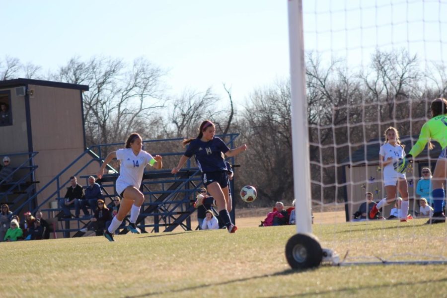 Junior Sarah Kruising shoots a goal inside the 18-yard line.