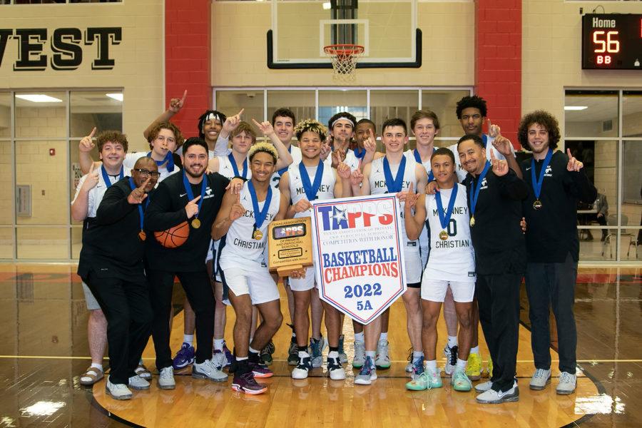 The boys state championship banner and the team. 