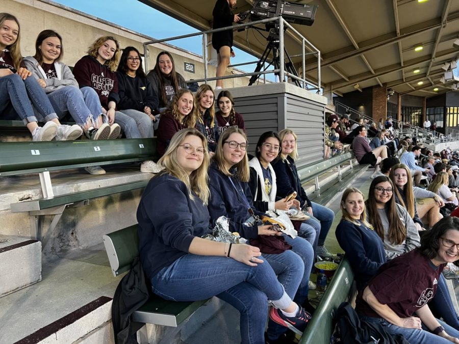The group of juniors take a picture while enjoying the A&M baseball game. 