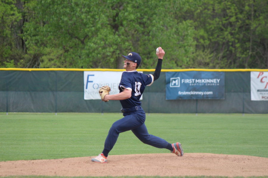  Senior Greg Jessup pitches the ball. 