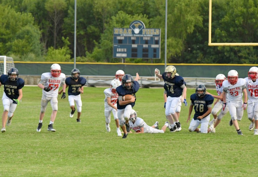 Eighth grader Luke Dreffs breaks tackles to take it in for a touchdown.