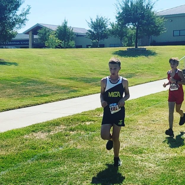  7th grader Ben Wall pushes himself towards the finish Line.
