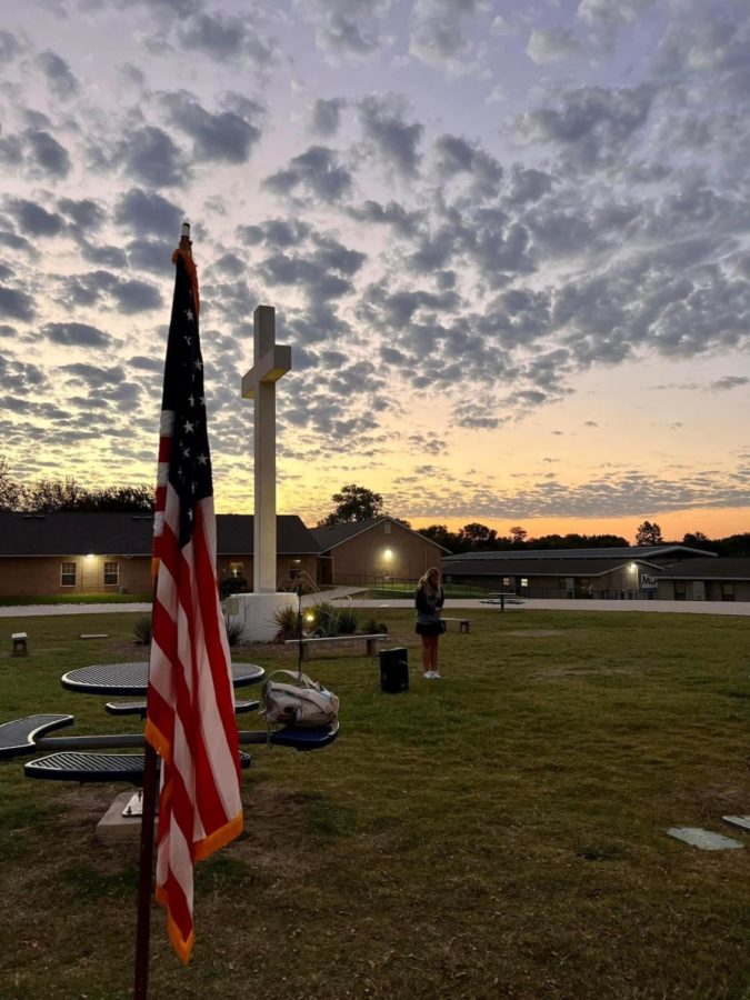 Middle School student praying for the health of the country.