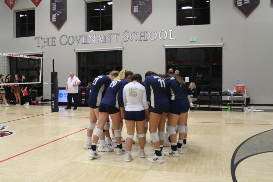 Varsity Mustangs huddle before the game.