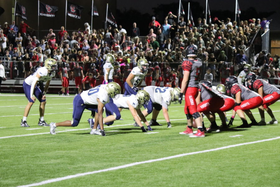 Mustangs get ready to start the next play. 