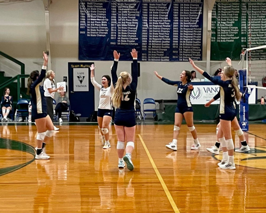 The Lady Mustangs celebrate as they earn a point for the round