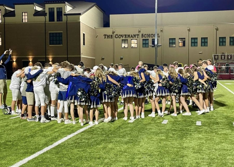The Middle School Football team and Cheerleaders pray together.