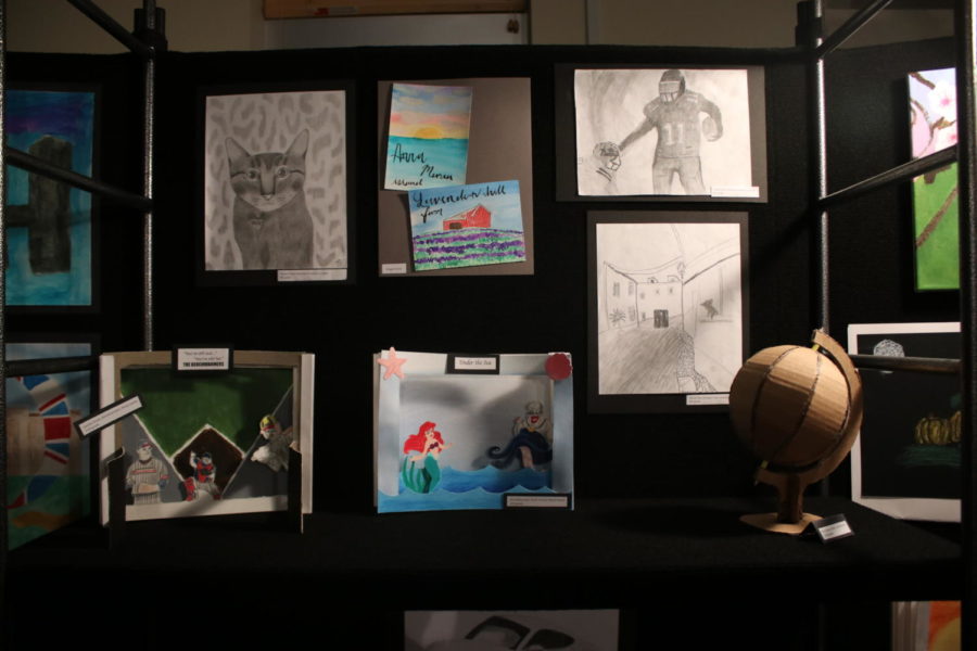 Upper and Middle School students’ Art is displayed. 