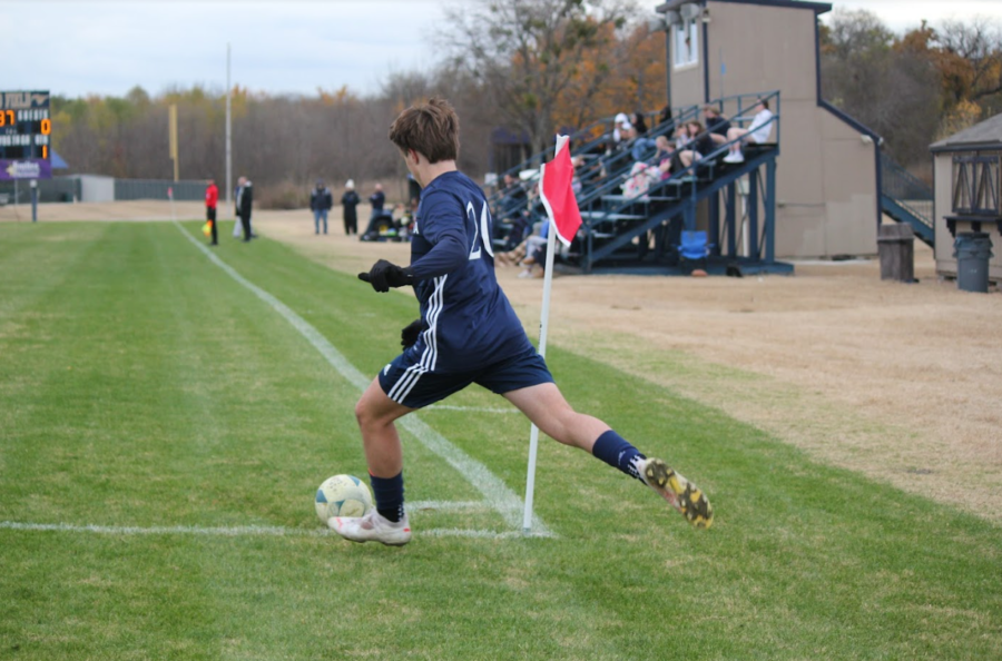 Junior Liam Corely kicks a corner.