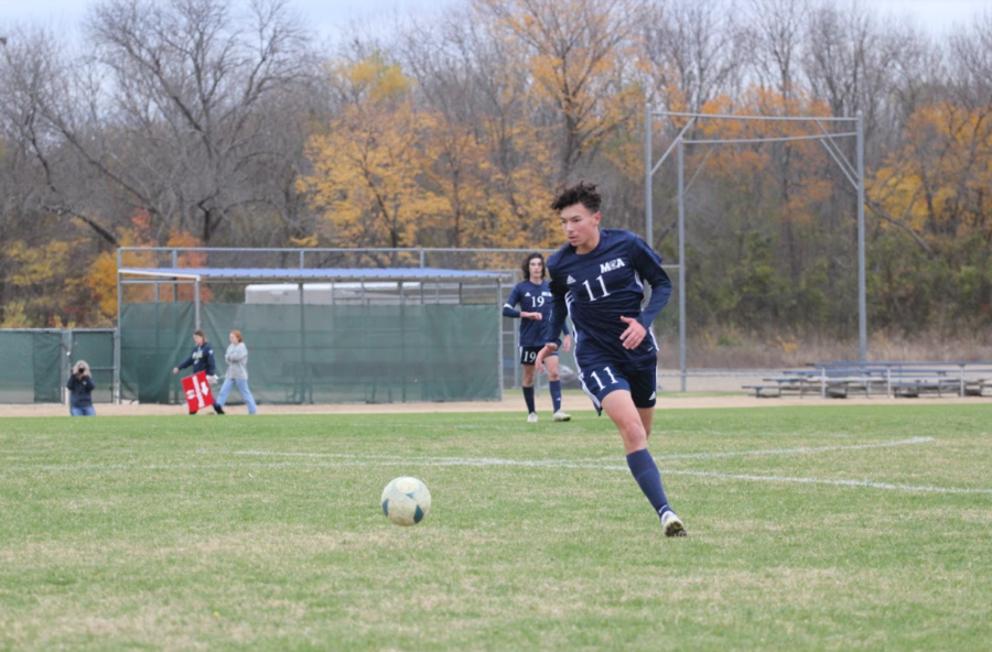 Junior Max Luna takes the ball up the field.