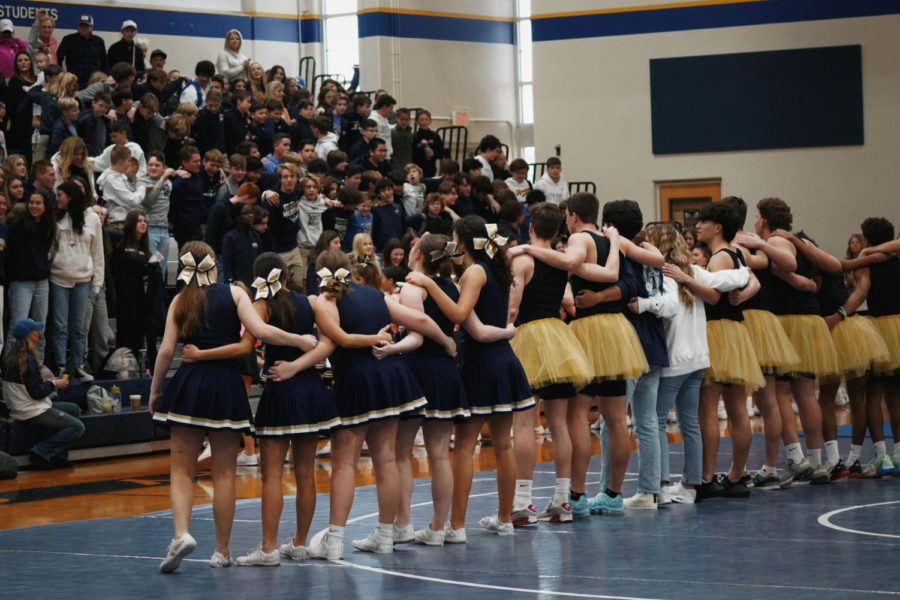 Mustang+cheerleaders+and+basketball+team+after+performing+at+the+pep+rally.