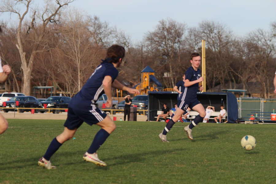 Junior Nick Catullo passes the ball to freshman Grady Rogers.