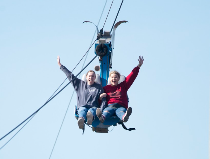 Seniors, Sydney Scrivner and Macy Warshawsky, take a trip on the zipline. 
