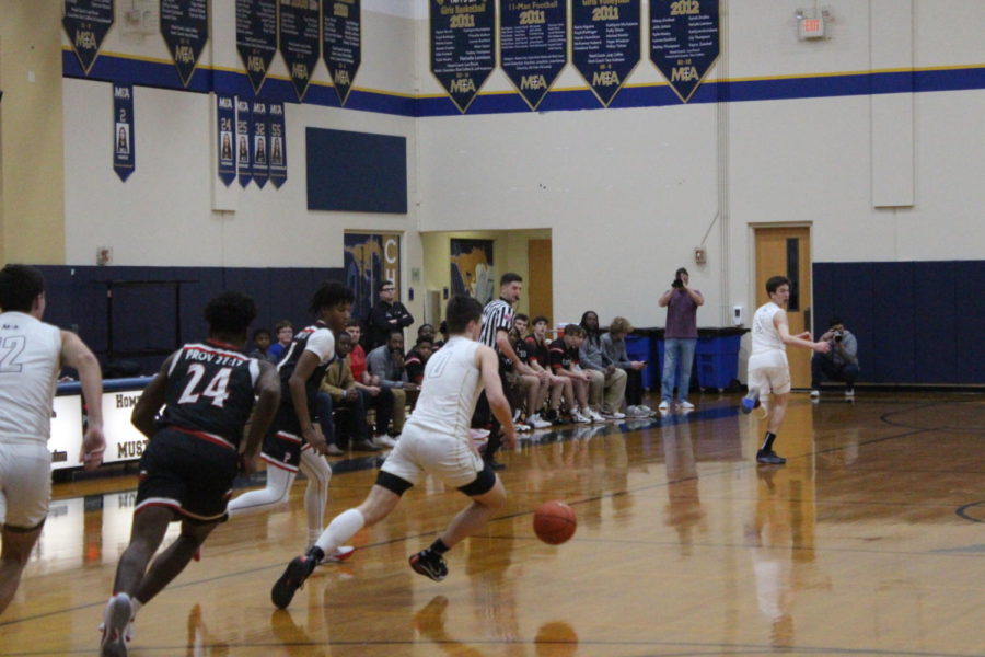 Senior Bobby McWard races down the floor after a steal.