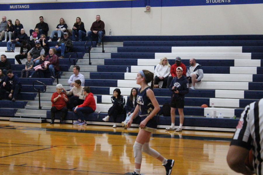 Freshman Sadie Zbranek waits for Brook Hills attack.