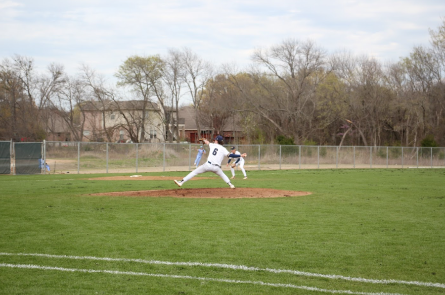 Sophomore Marc Jensen throws a pitch.