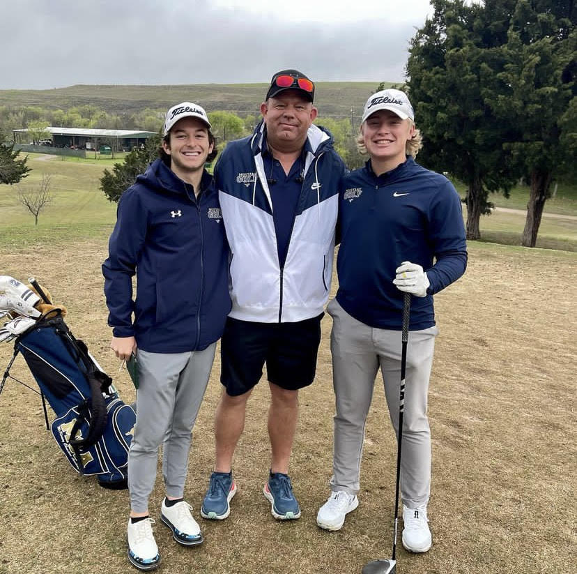 Junior Nicholas Catullo and Sophomore Jude Westra pose with Head Coach Russell Tucker.   