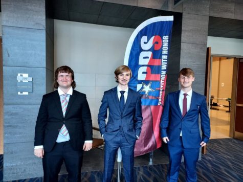 Debate team poses for a picture at TAPPS.