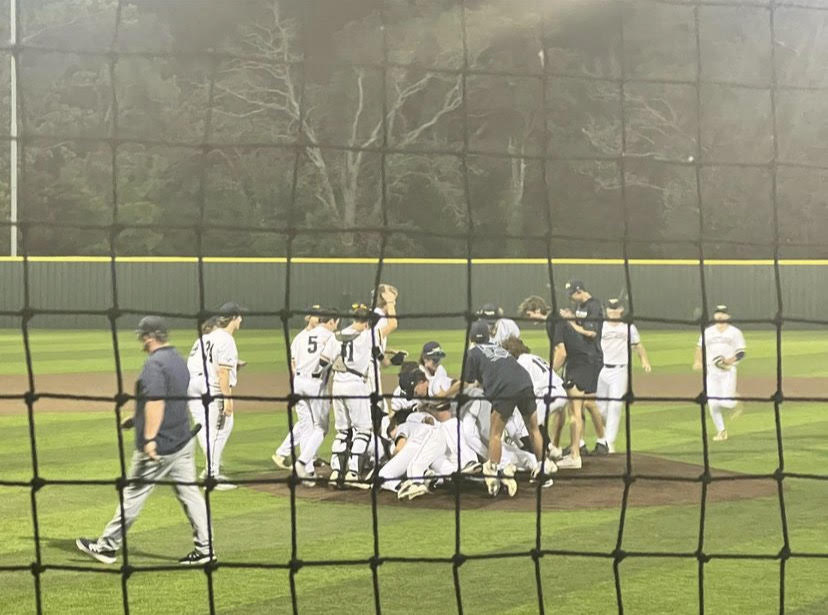 The Mustangs dog pile on the field as soon as the last strike is thrown.