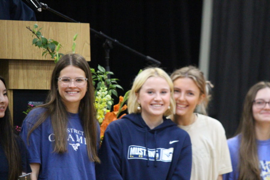 Seniors Lily Jornod, Brooke Jensen and Kate Nordhaus are recognized in front of the stage.