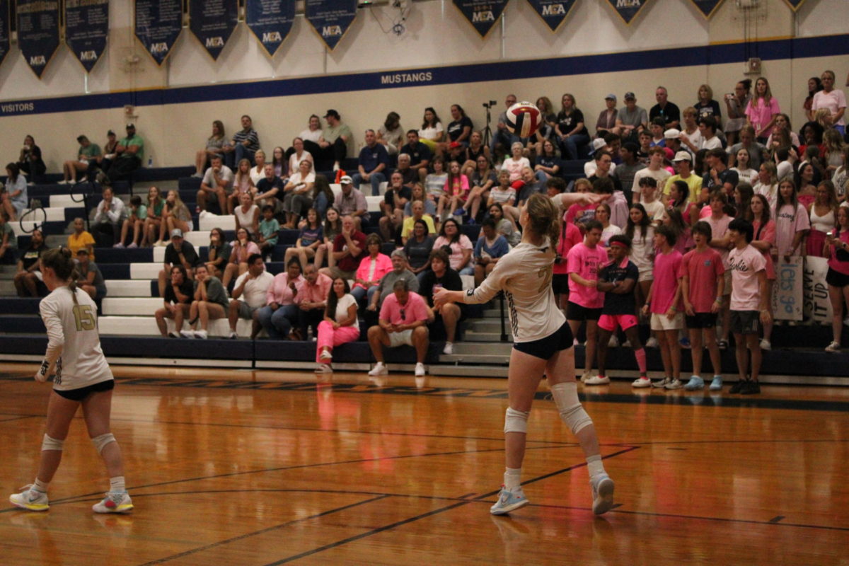 Senior Kaylin Starling serves the ball over the net.