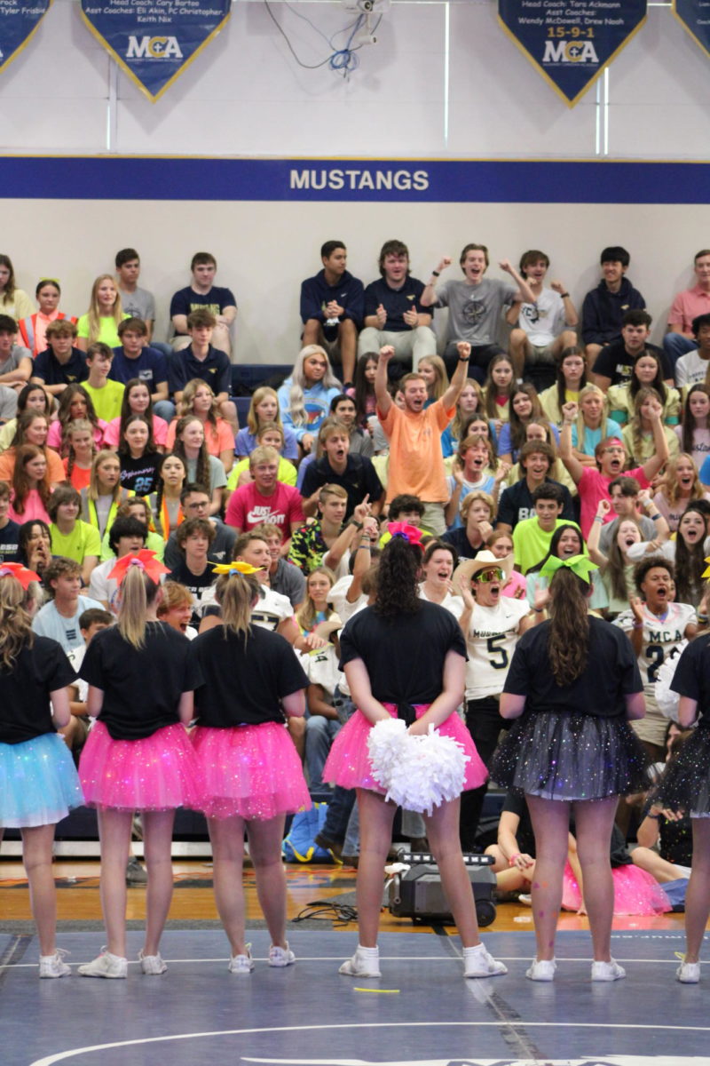 The Upper School Students Cheer for the Spirit Stick.