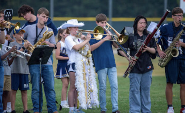 The MCA Middle School and High School band performs at Tailgate.
