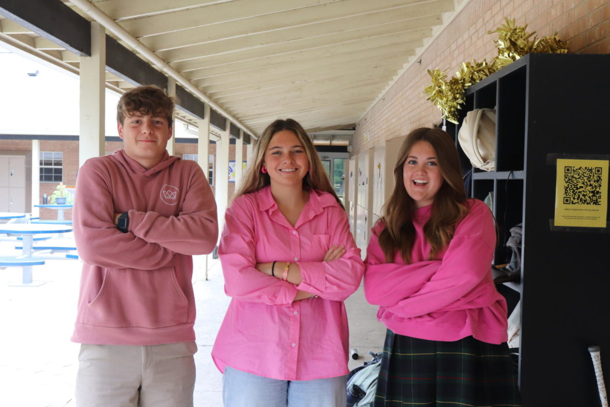 Juniors Evan Bleecker, Brooklyn Claudio, and Hannah Massingale dress up in pink for color wars
